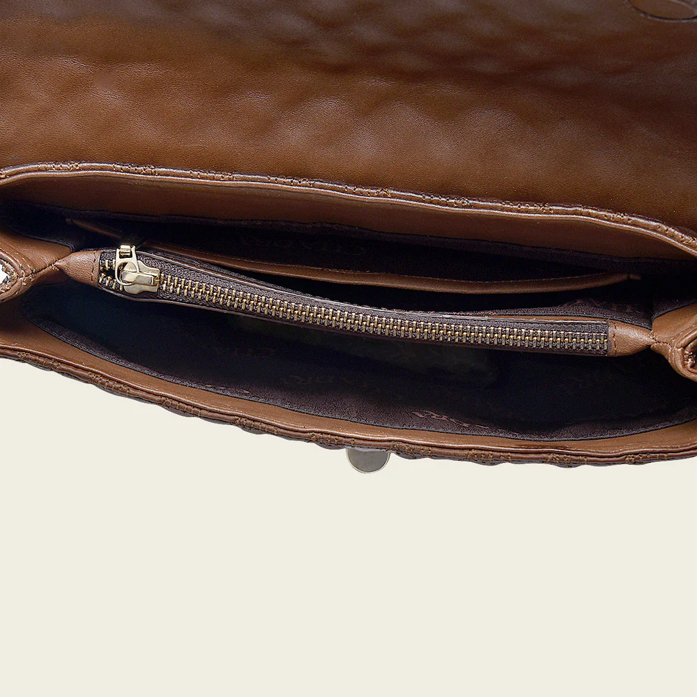 Brown bovine shoulder handbag